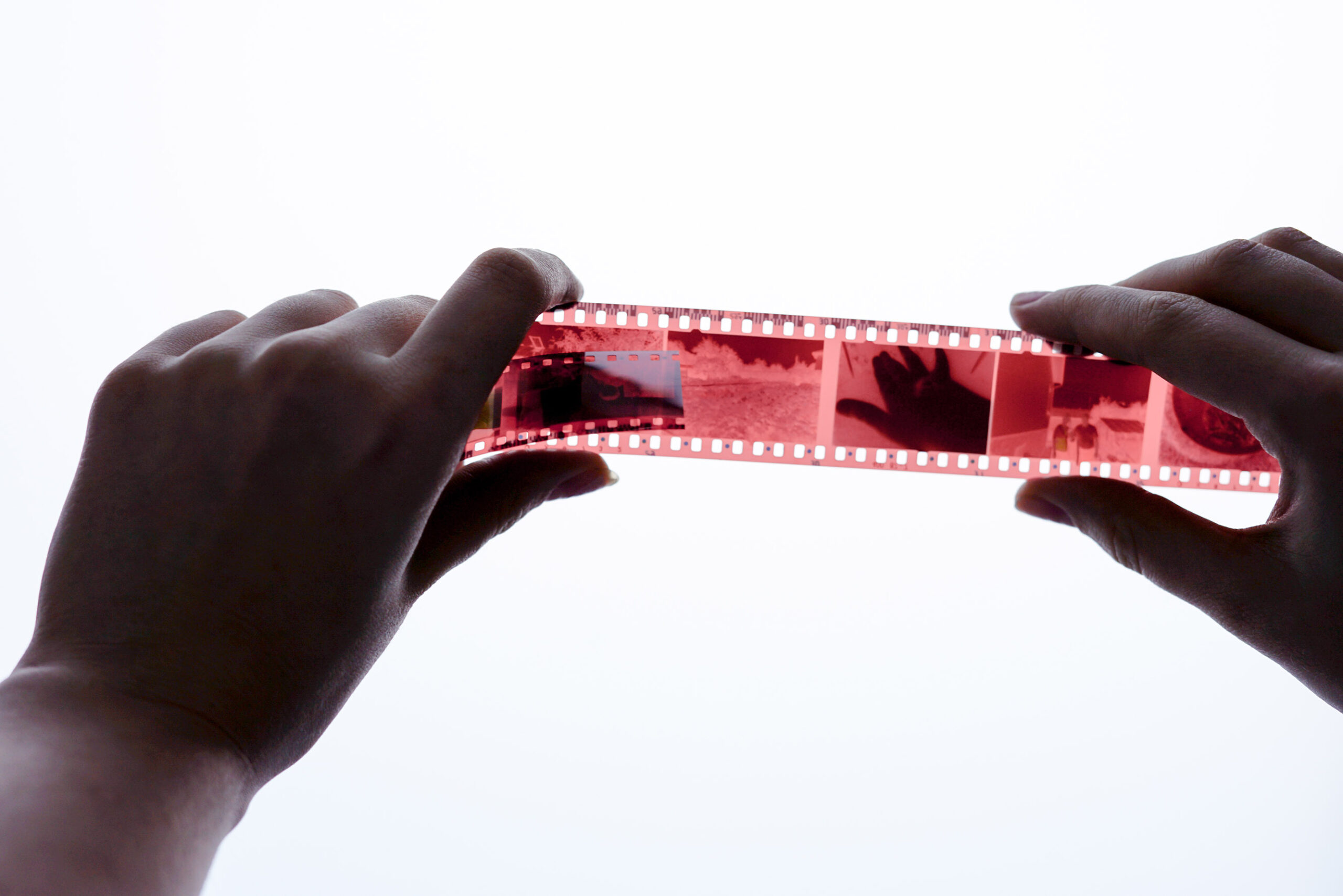 analog-photography-on-filmstrip-hands-holding-ph-2023-11-27-04-57-51-utc