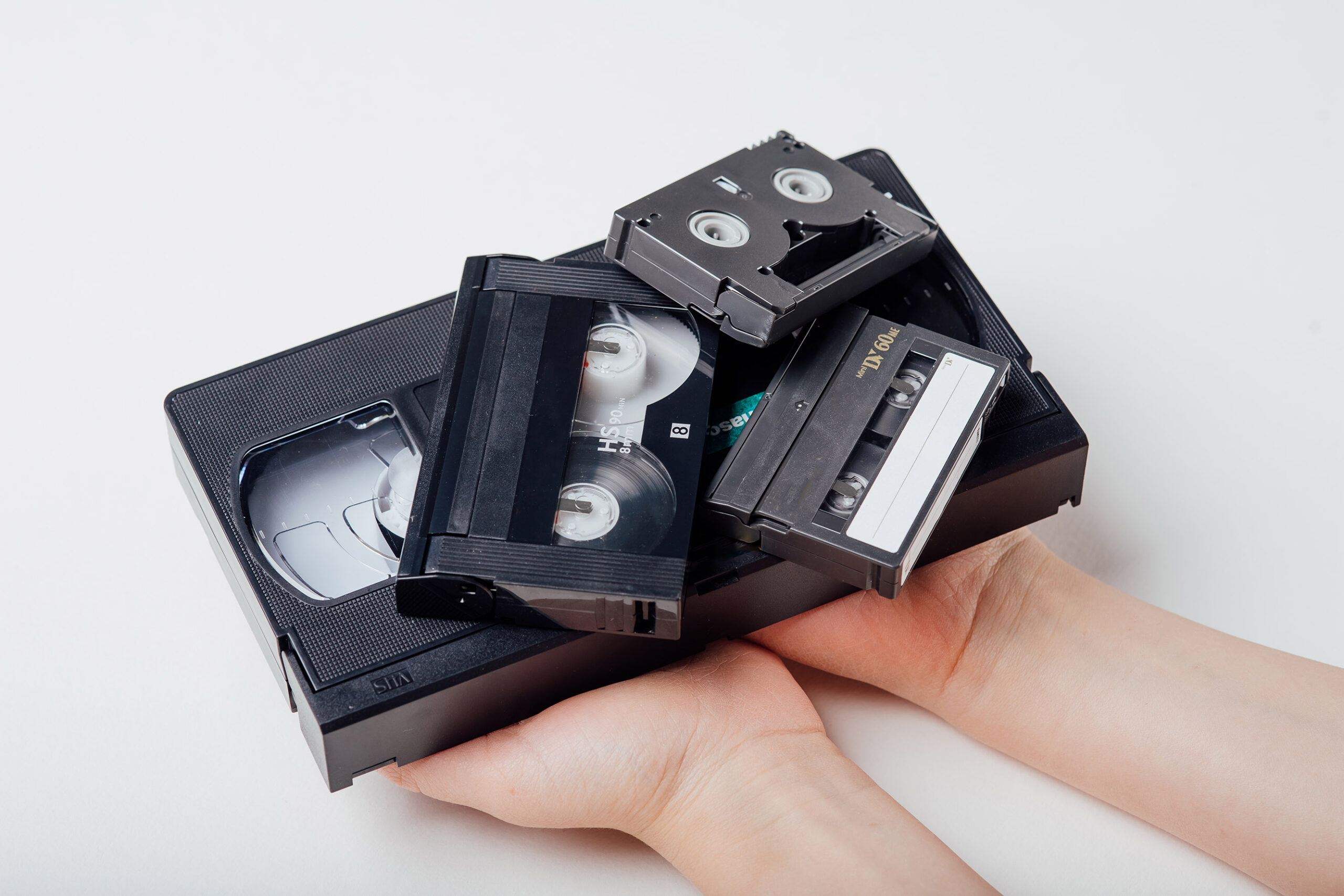close up, video tape in child hand, isolated on white background,