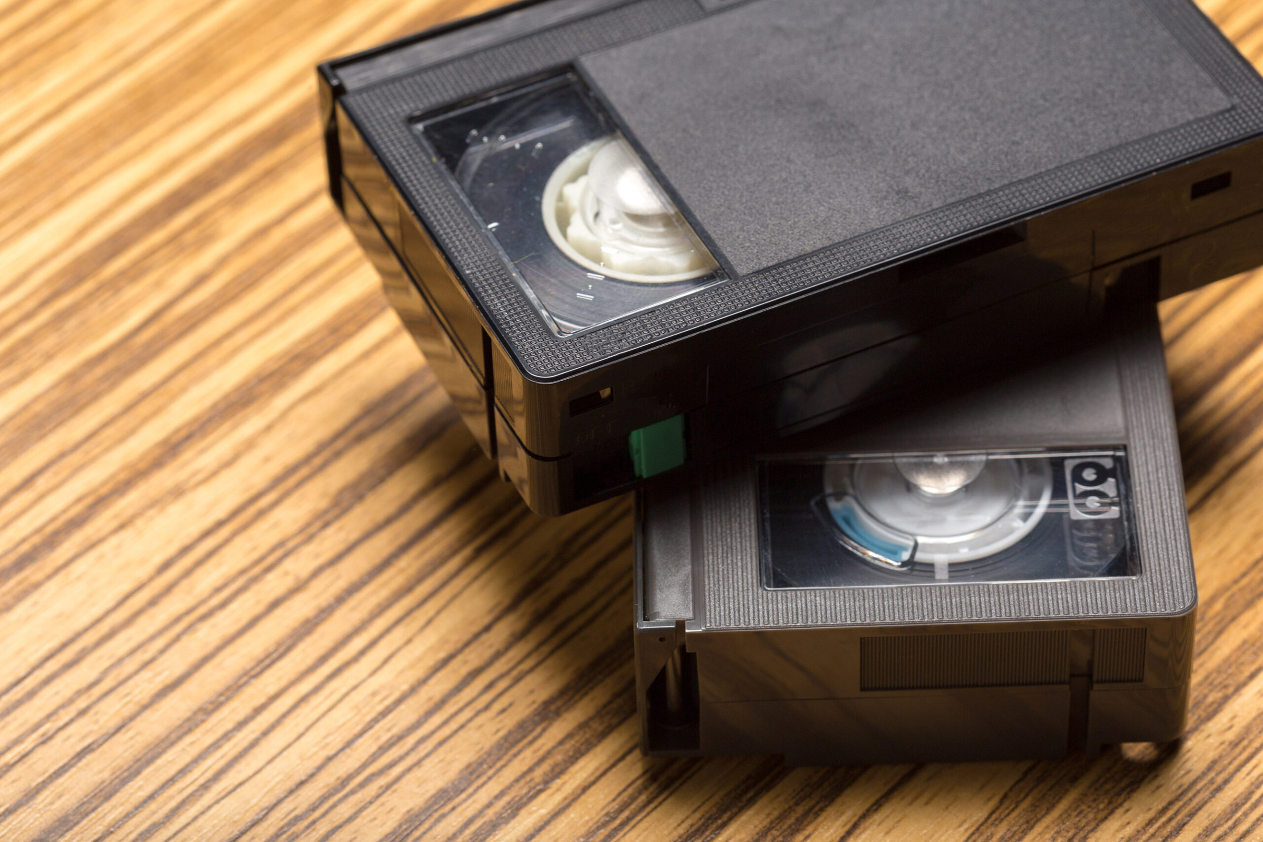 video tape cassette over wooden background