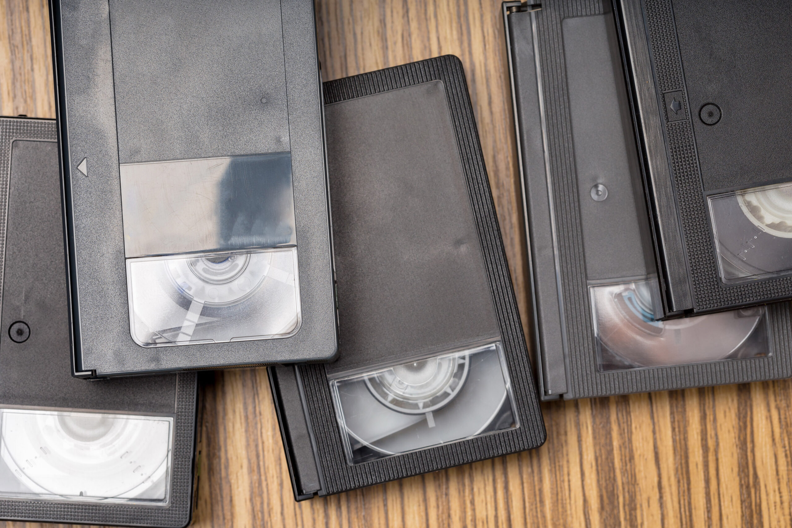 video tape cassette over wooden background